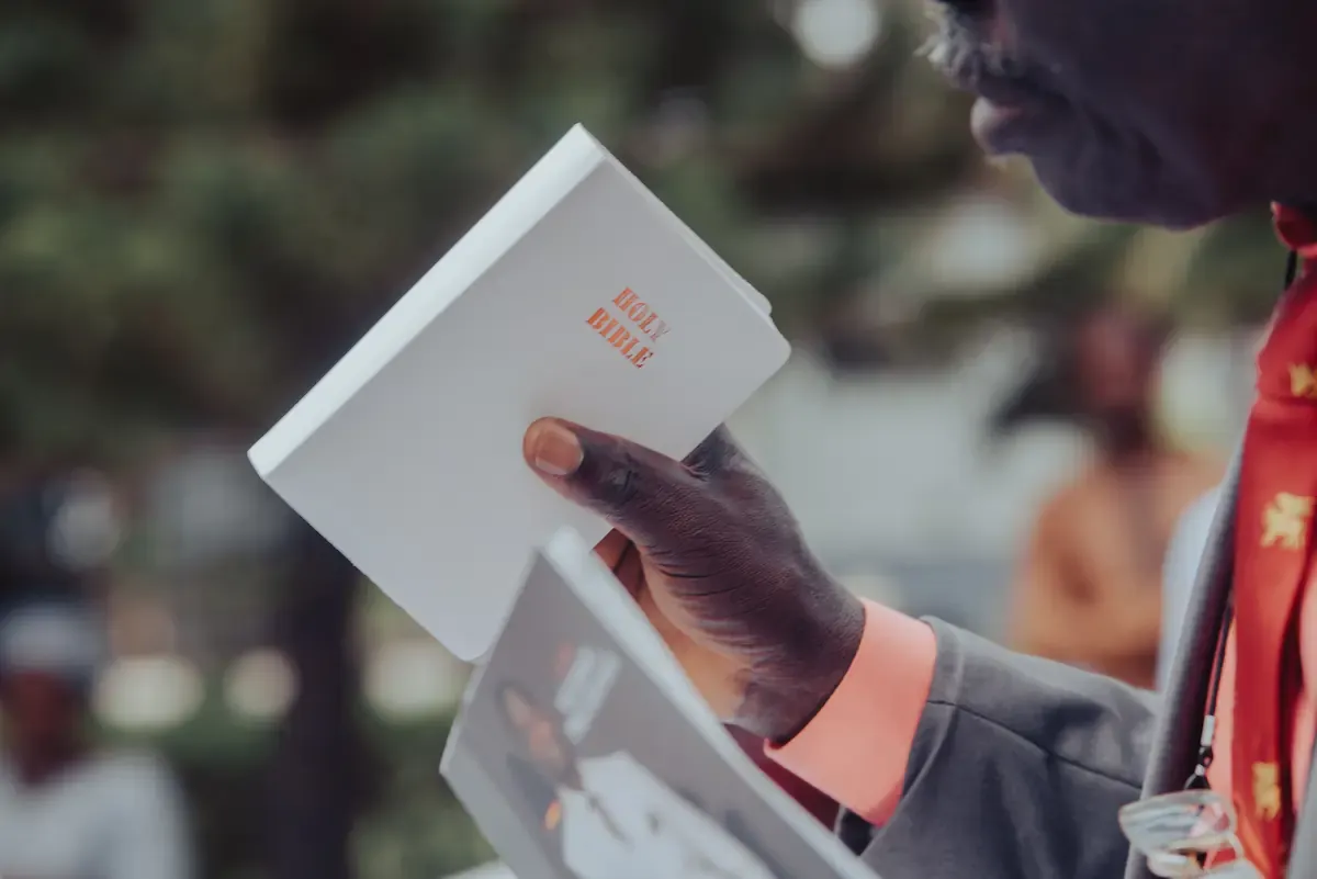 A minister holding a Bible ready to preach